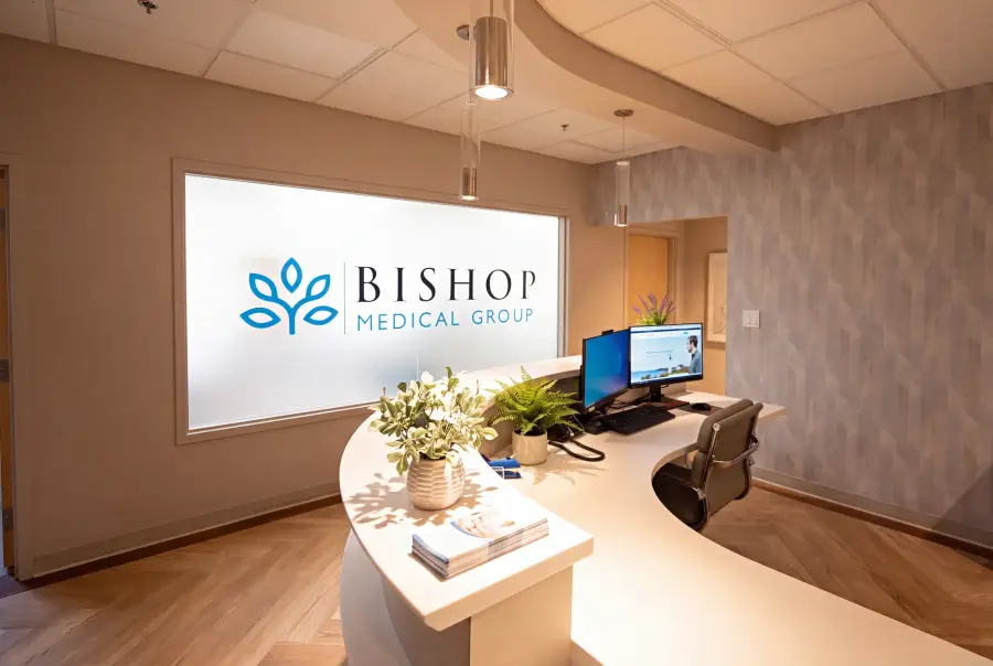 The curved reception desk at Bishop Health