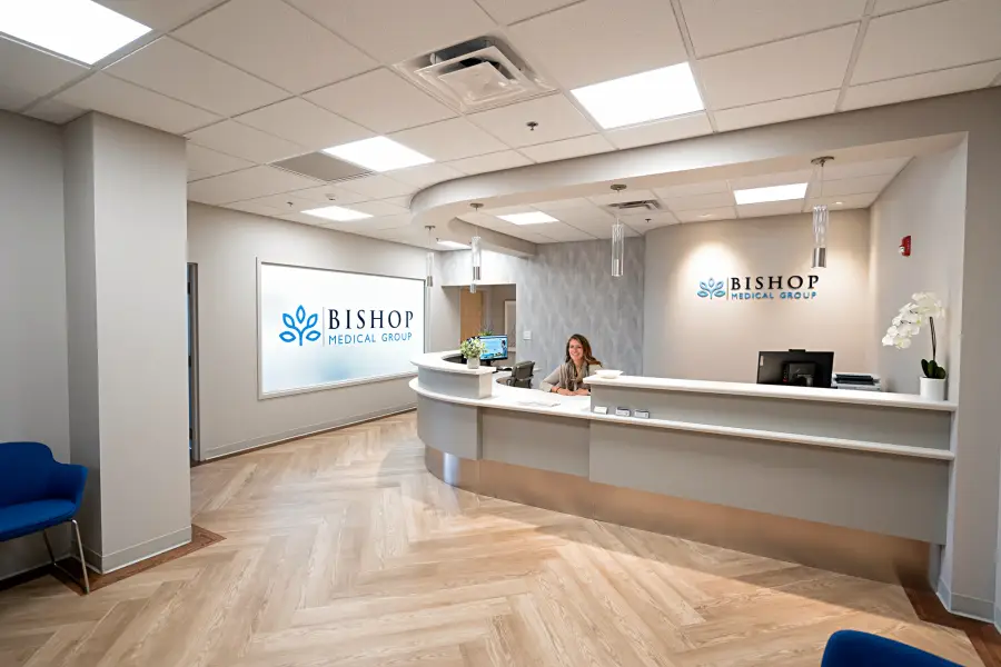 Front office staff at the Bishop Health reception desk